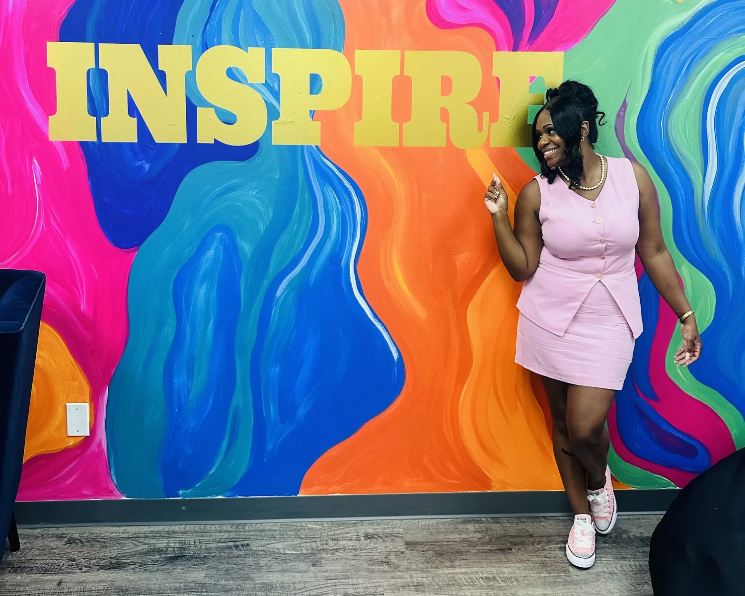 A colorful hand-painted mural with the word INSPIRE inside the Infinity Counseling & Wellness Center office in Crown Point, Indiana